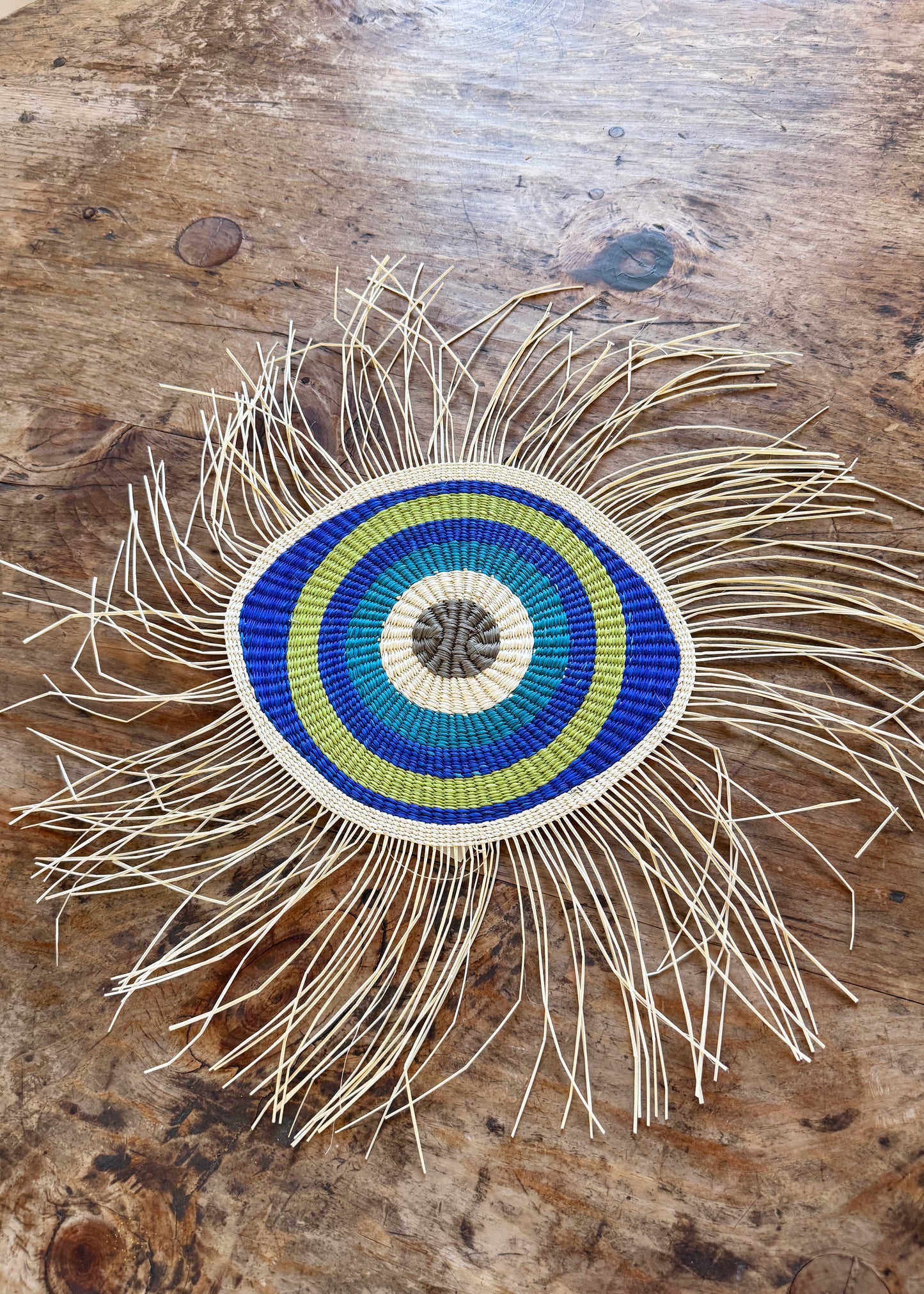 hand woven evil eye wall art from Honduras