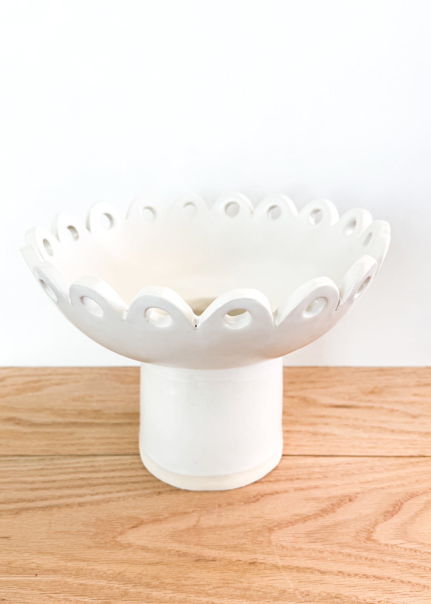 scalloped pedestal vase