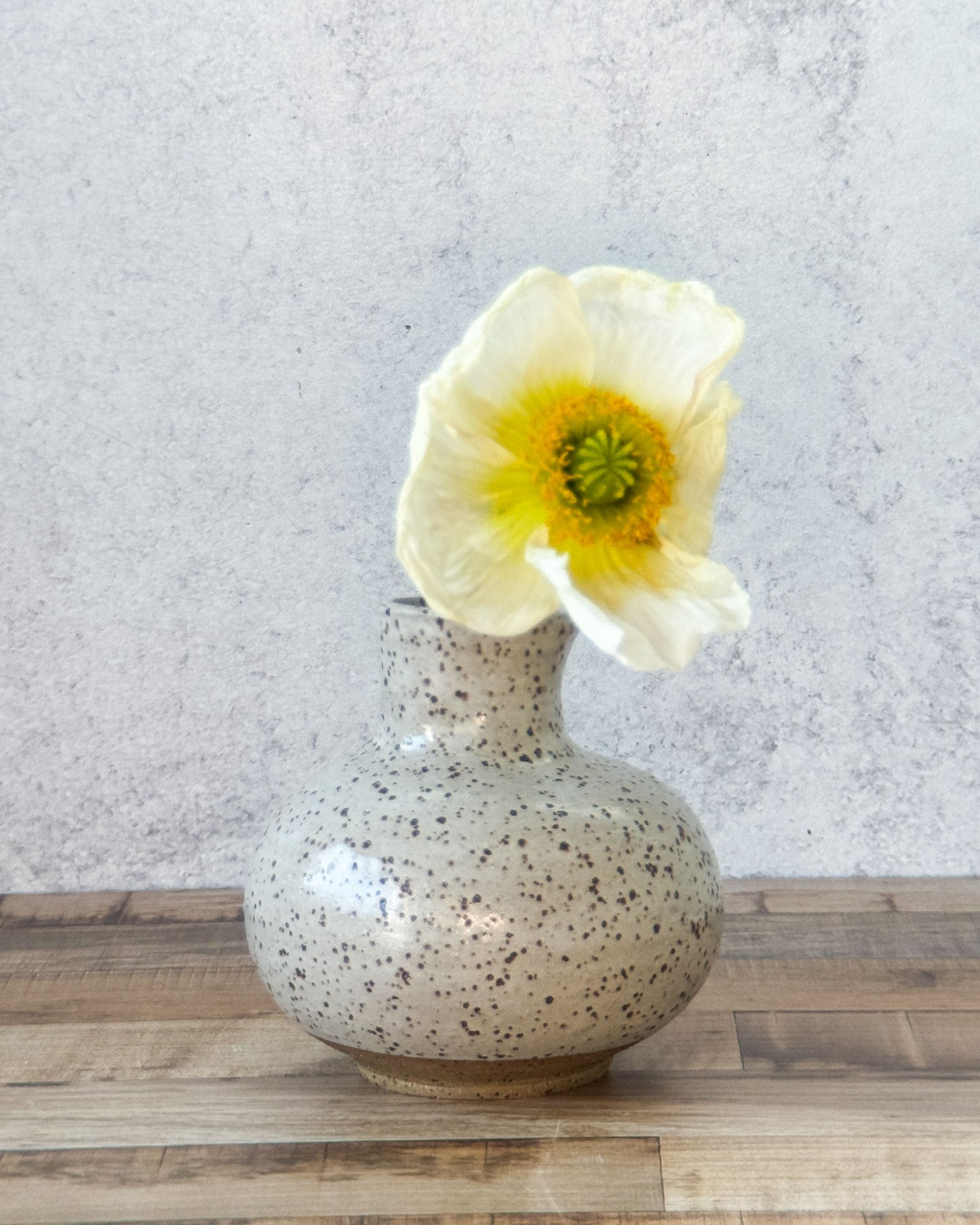 small speckled bud vase