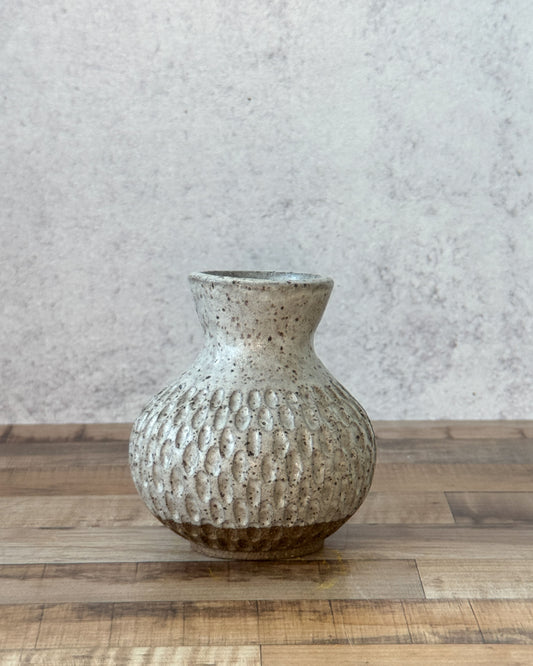 small carved speckled bud vase