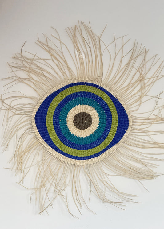 hand woven evil eye wall art from Honduras